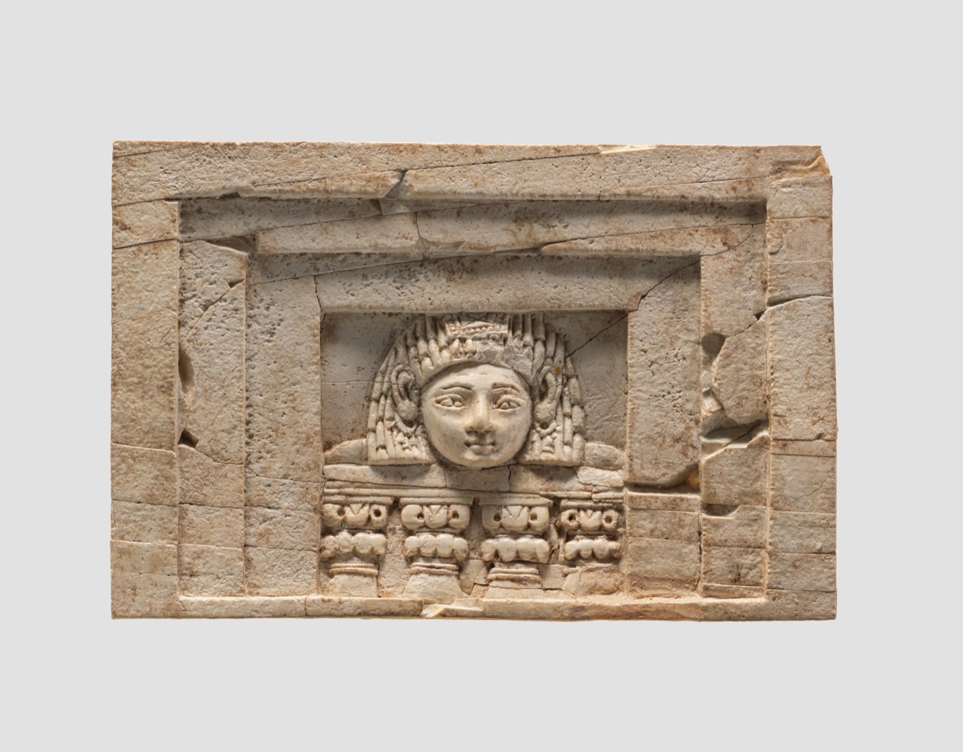 Furniture plaque carved in relief with a “woman at the window”