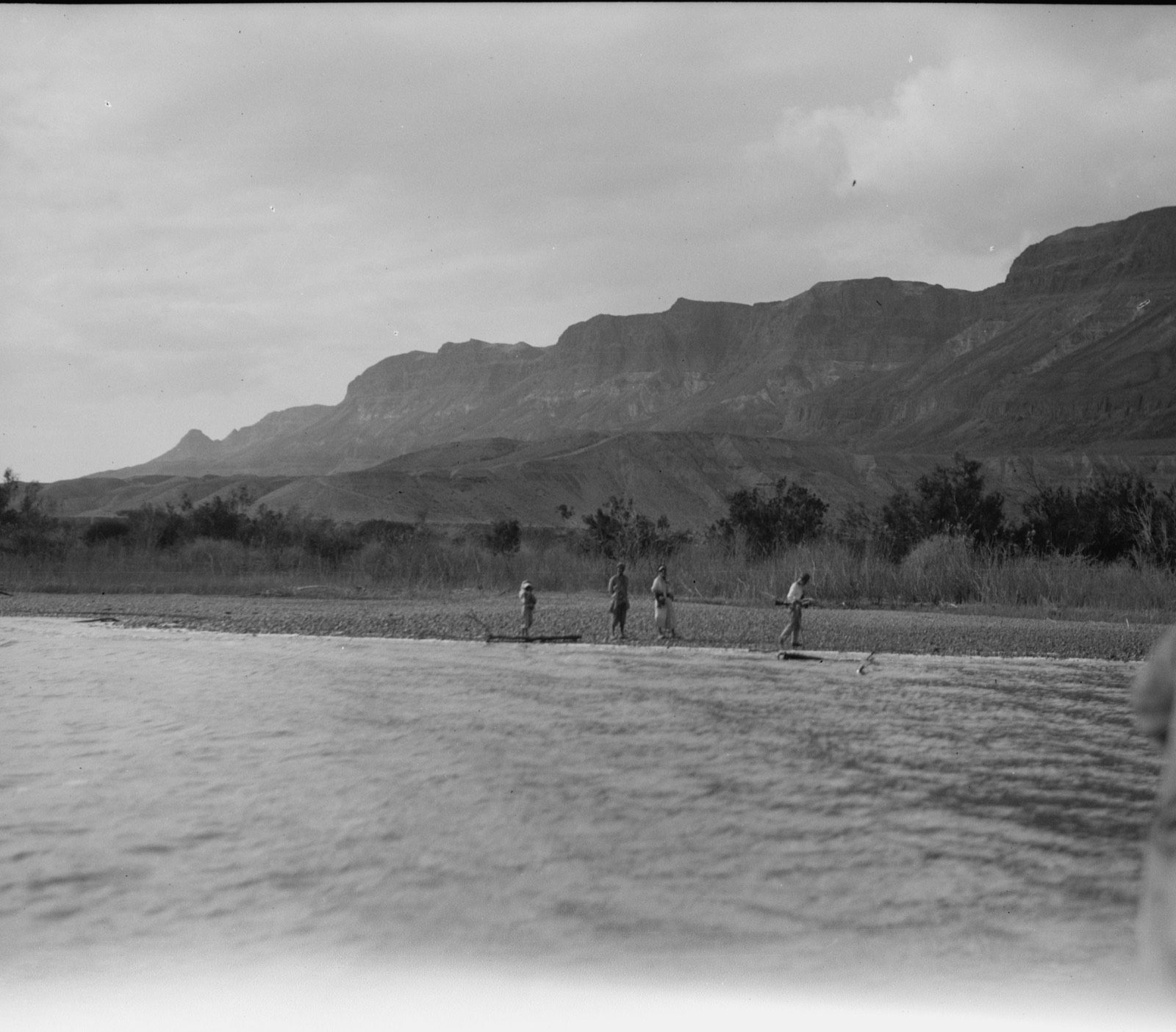 Motor boat trip around the Dead Sea. Engedi. Precipitous western shoreline